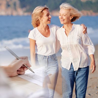 Collage of two people walking on a beach and a hand signing a piece of paper