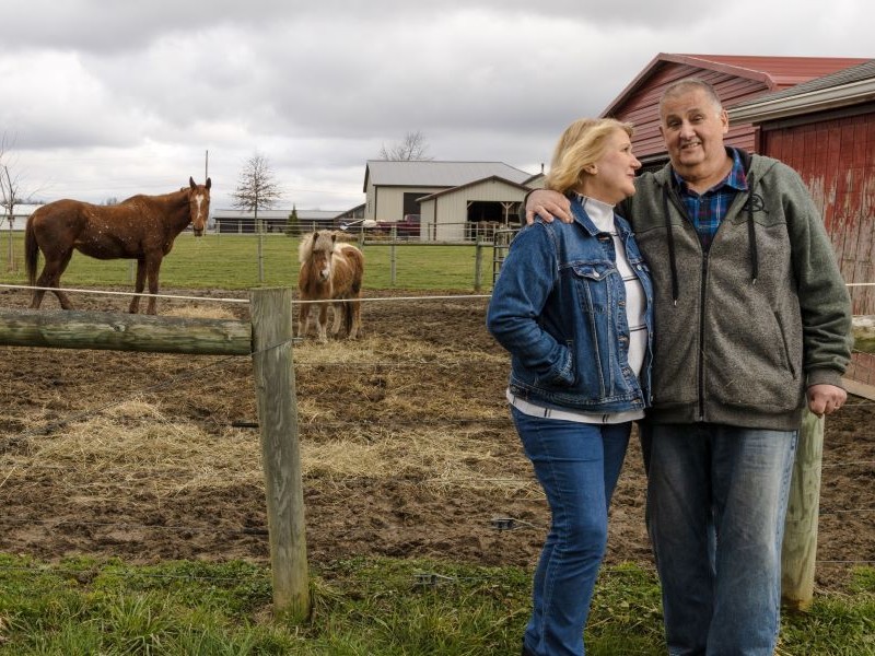 Henry and wife by horses
