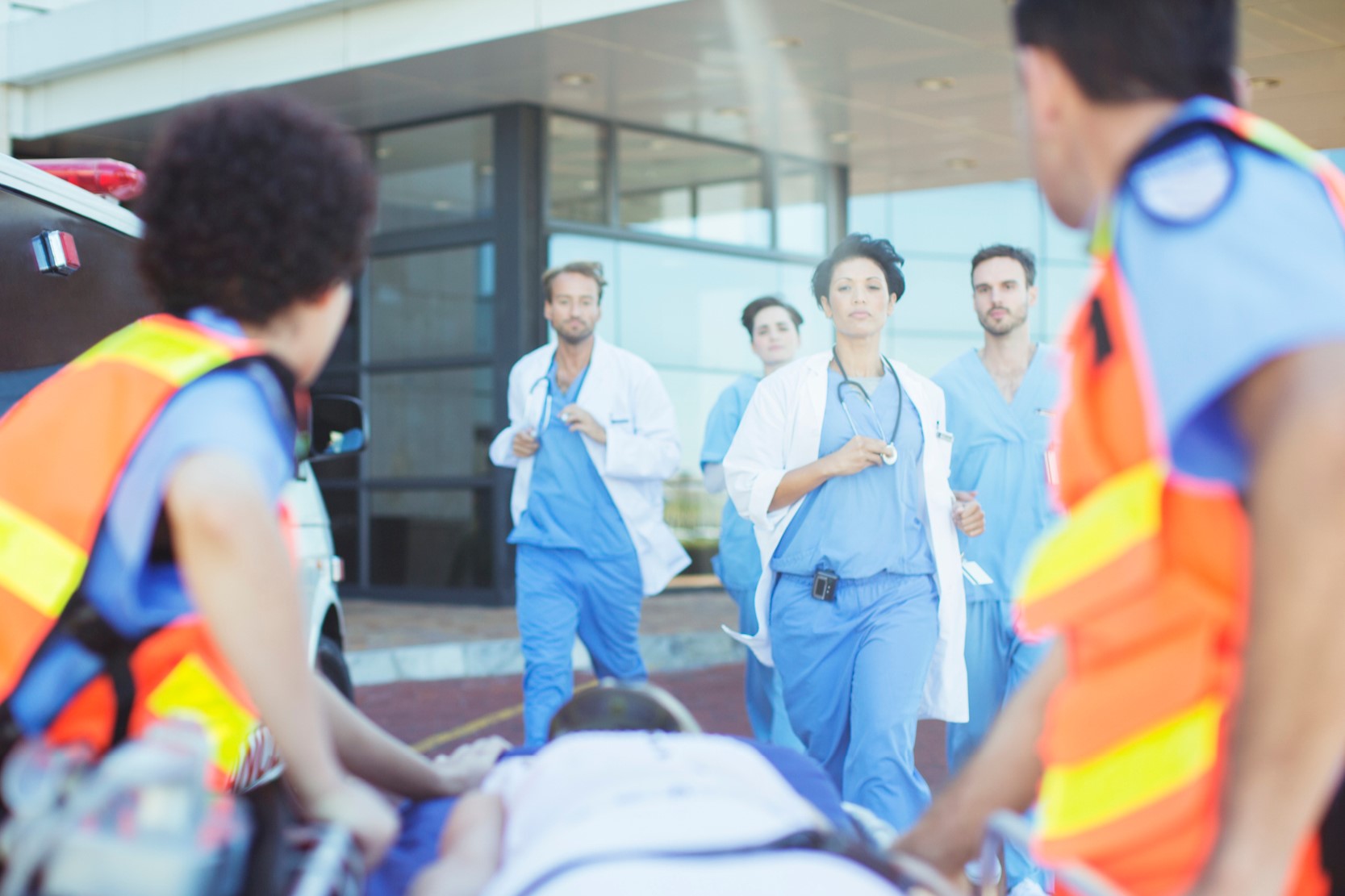 Doctors running to ambulance